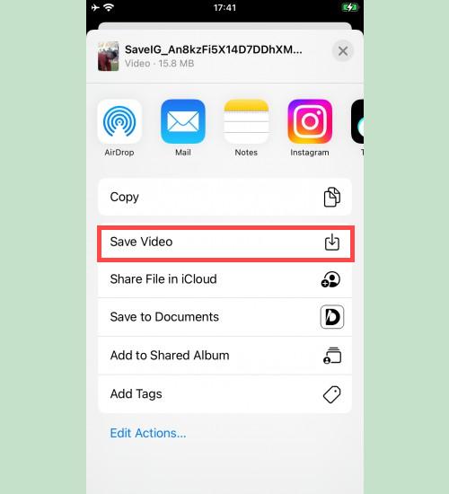 Enregistrement de la vidéo depuis SaveVid dans Photos : Écran iPhone affichant l’option 